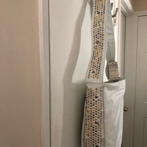 Woman’s white leather bag